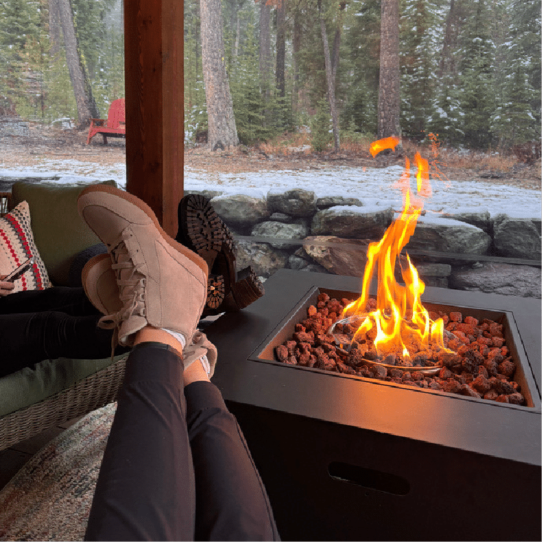 Relaxing time by the fire at cozy mountain retreat near Whitefish Montana