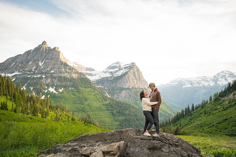 Val B practicing yoga in front of Montana mountains, connecting with nature