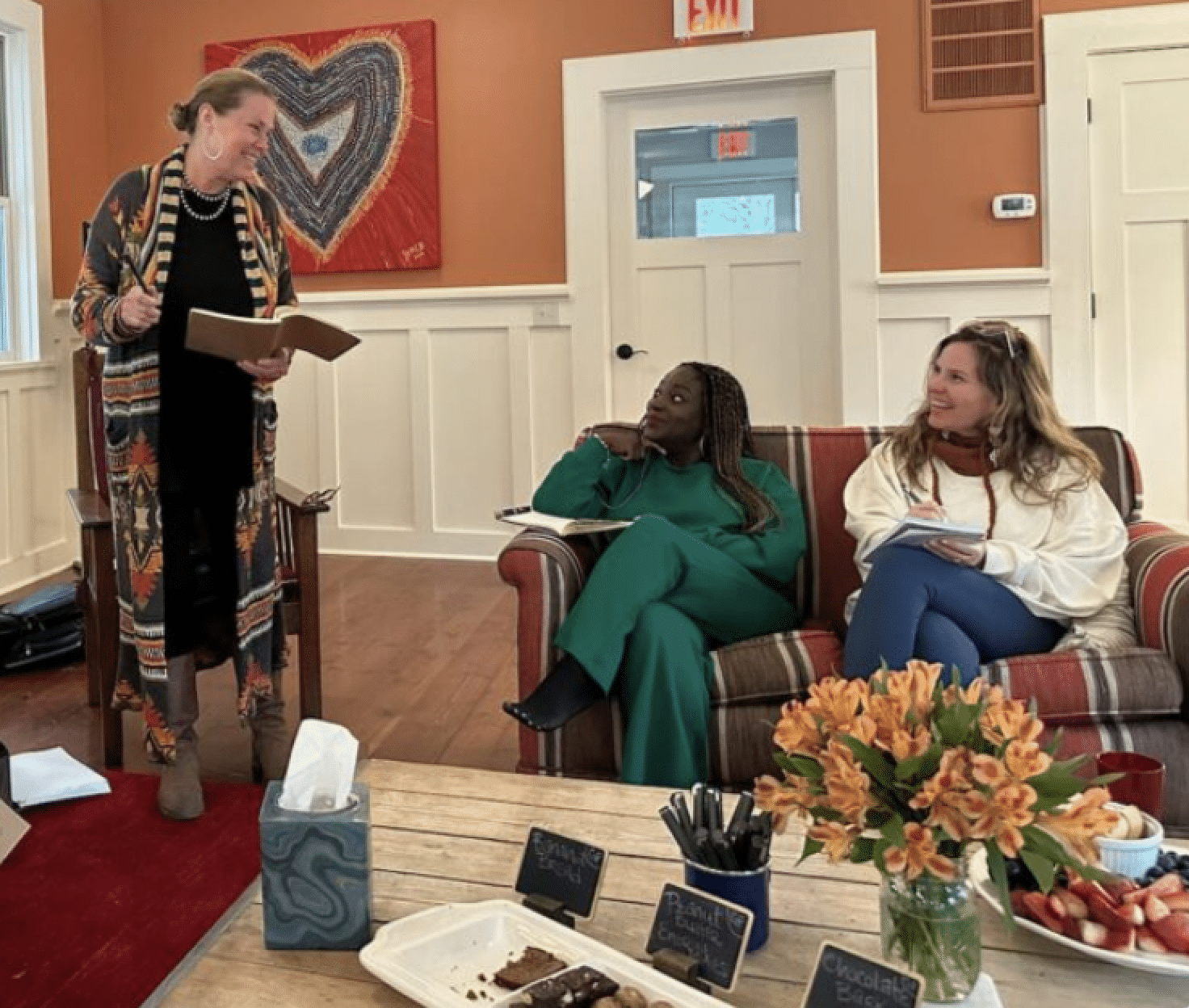 woman seated on paddleboard in yoga pose on a lake near whitefish montana