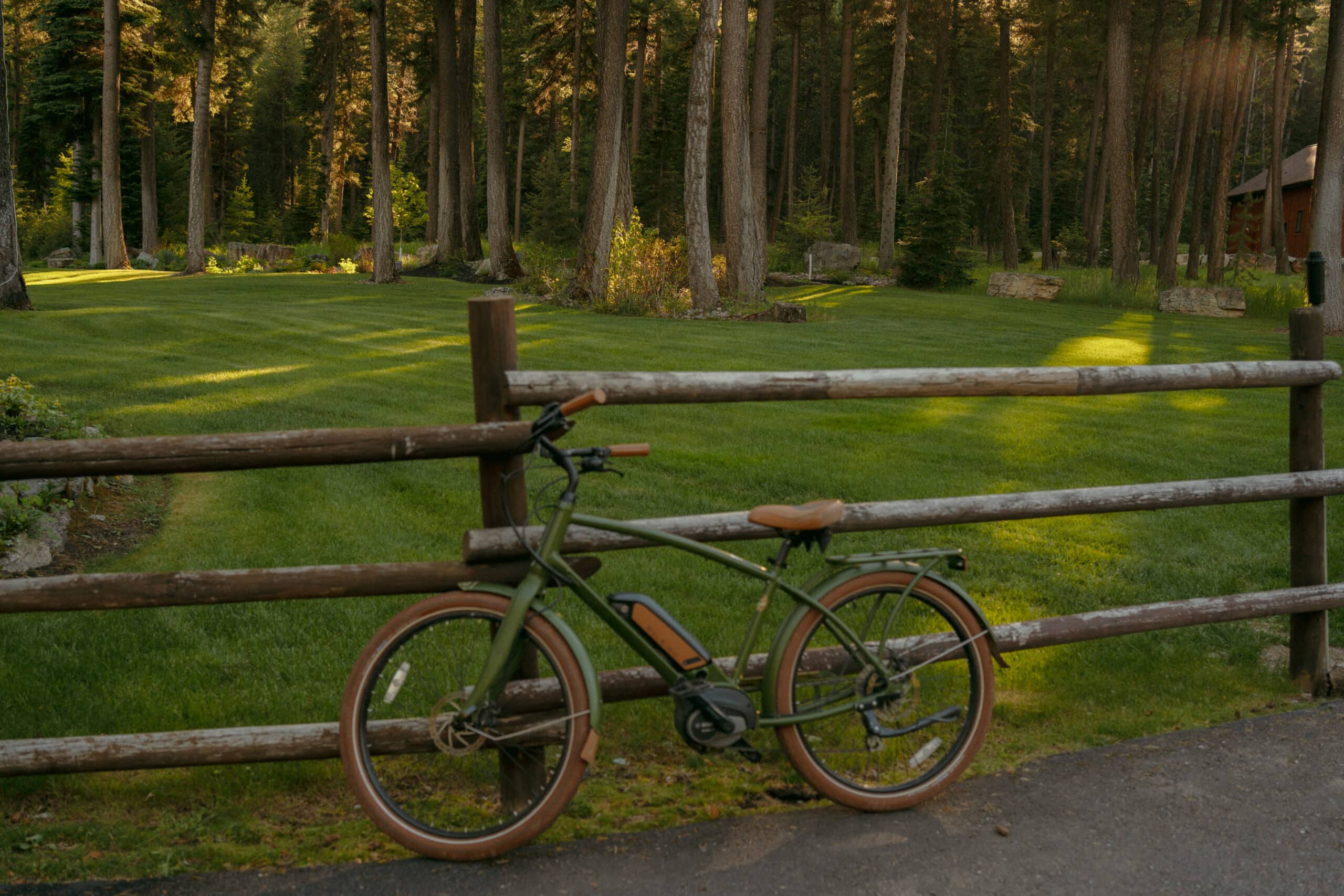 bike leaning against a fence at a beautiful retreat location in whitefish Montana