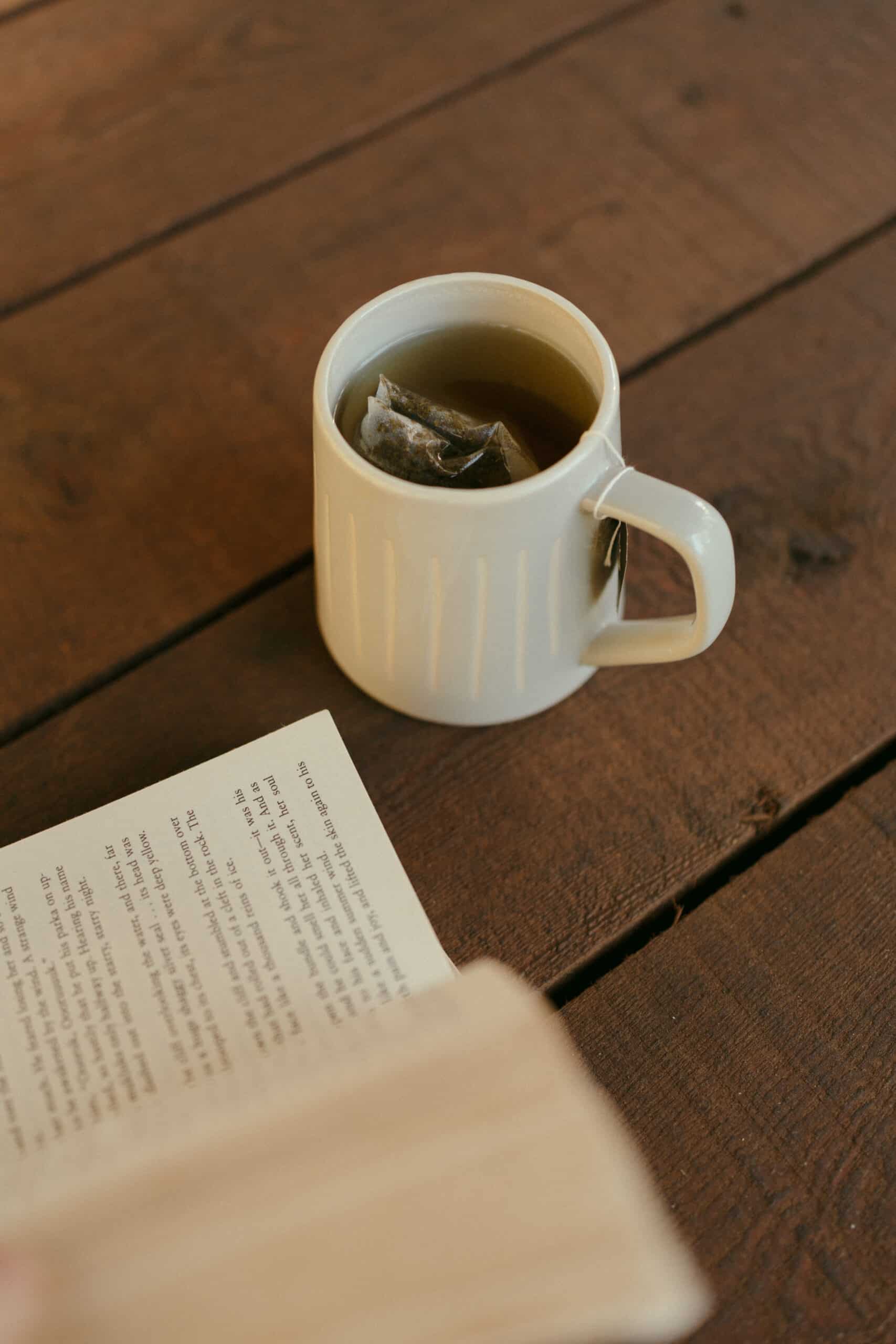 Cup of tea and open book relaxing moment at Whitefish retreat