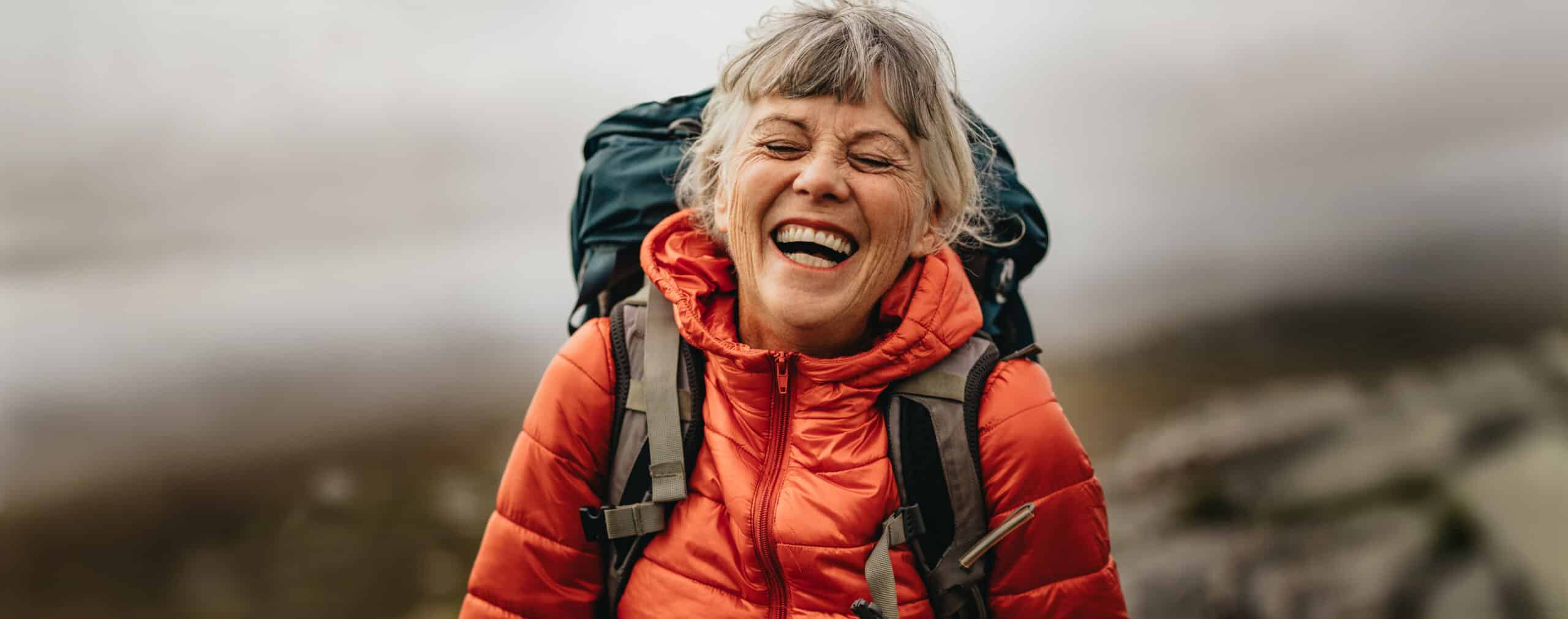 Joyful woman hiking in mountains near Whitefish MT
