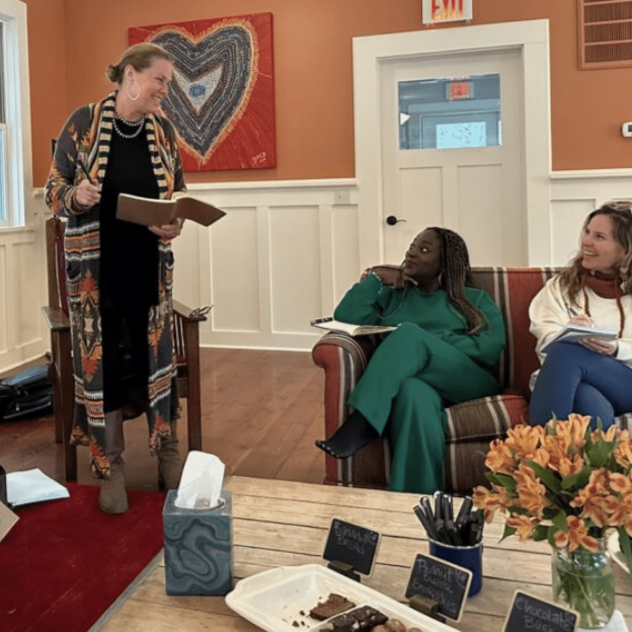 Older couple sitting on a log in nature enjoying a beautiful retreat in Whitefish Montana